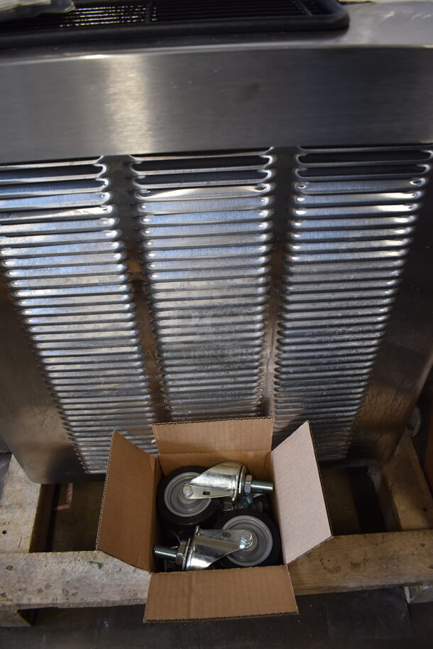 BRAND NEW! 2022 Stoelting O231-30912F Commercial Stainless Steel Air Cooled Soft Serve Ice Cream Machine With 2 Hoppers. Includes Box of Commercial Casters, Operators Manual And Cleaning Supplies. 208-230V, 3 Phase. Tested And Working!  - Image 7 of 12