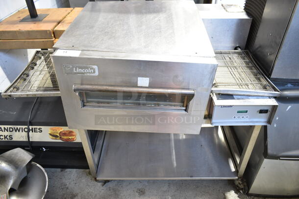 Lincoln Impinger 1132-002-U-K1841 Stainless Steel Commercial Floor Style Electric Powered Conveyor Pizza Oven w/ Under Shelf on Commercial Casters. 208 Volts, 3 Phase. - Image 1 of 10