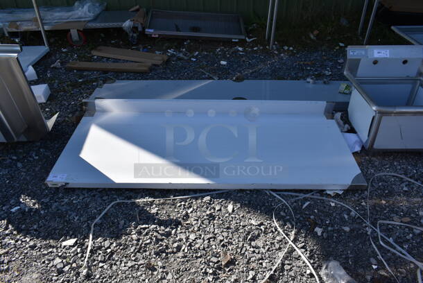 BRAND NEW SCRATCH AND DENT! Regency 600TSB3072S Stainless Steel Commercial Tabletop w/ Back Splash. - Image 1 of 3