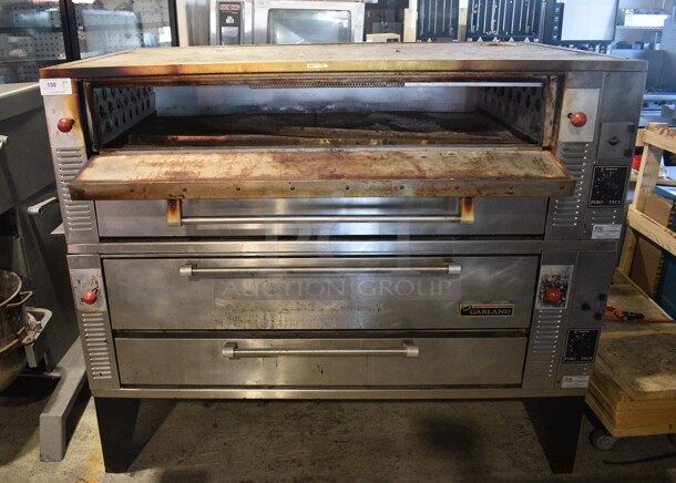 2 Garland Model GPD60 Stainless Steel Commercial Natural Gas Powered Single Deck Pizza Ovens w/ Cooking Stones on Metal Legs. 122,000. 81x49x63.5. 2 Times Your Bid! - Image 1 of 12