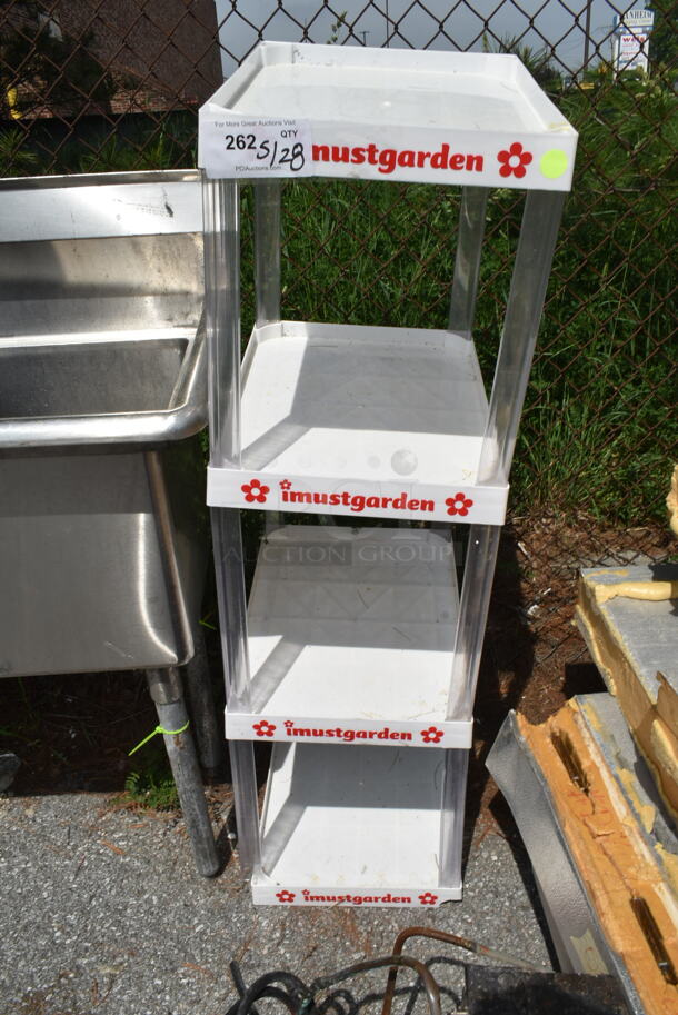 White Poly 4 Tier Shelving Unit.  - Image 1 of 1