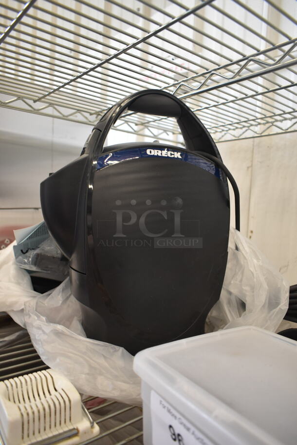 ALL ONE MONEY! Lot of BRAND NEW Oreck Canister Vacuum, Box of 6 Rubbermaid Food Pans, Plastic Drop-In Bins, Egg Slicer, AND MORE!    - Image 2 of 5