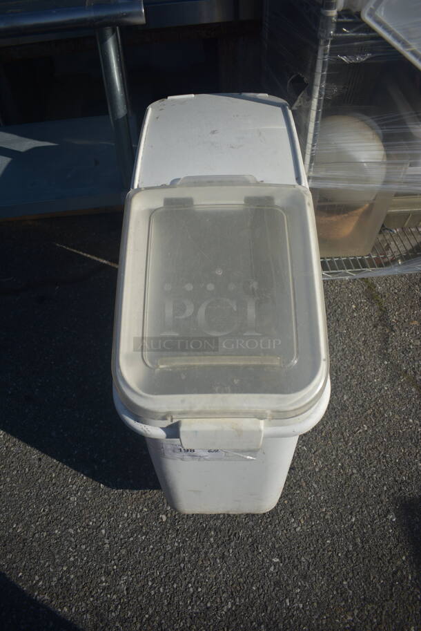White Plastic Garbage Bin With Clear Lid On Commercial Casters.