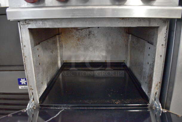 Vulcan Stainless Steel Commercial Natural Gas Powered 4 Burner Range w/ Oven, Over Shelf and Back Splash. 24x30x59 - Image 5 of 7