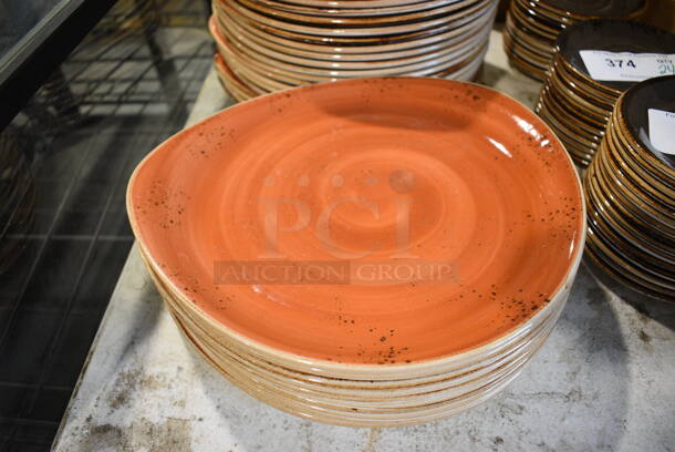 11 Orange Ceramic Plates. 12x11x1. 11 Times Your Bid!
