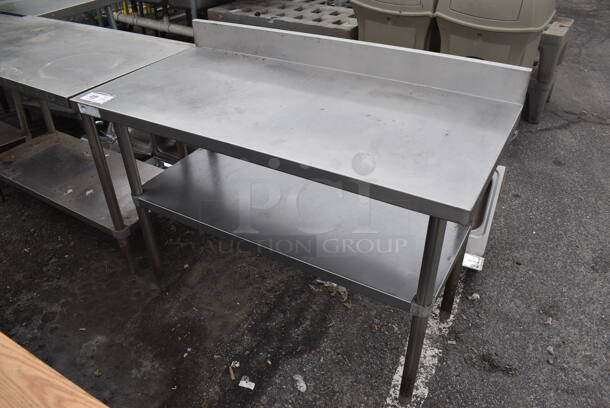 Stainless Steel Table w/ Back Splash and Under Shelf. 48x24x36