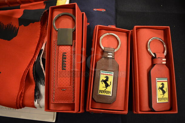 ALL ONE MONEY! Lot of Various Ferrari Items Including Keychains, Flag, Tie, and Accessory Book - Image 2 of 9