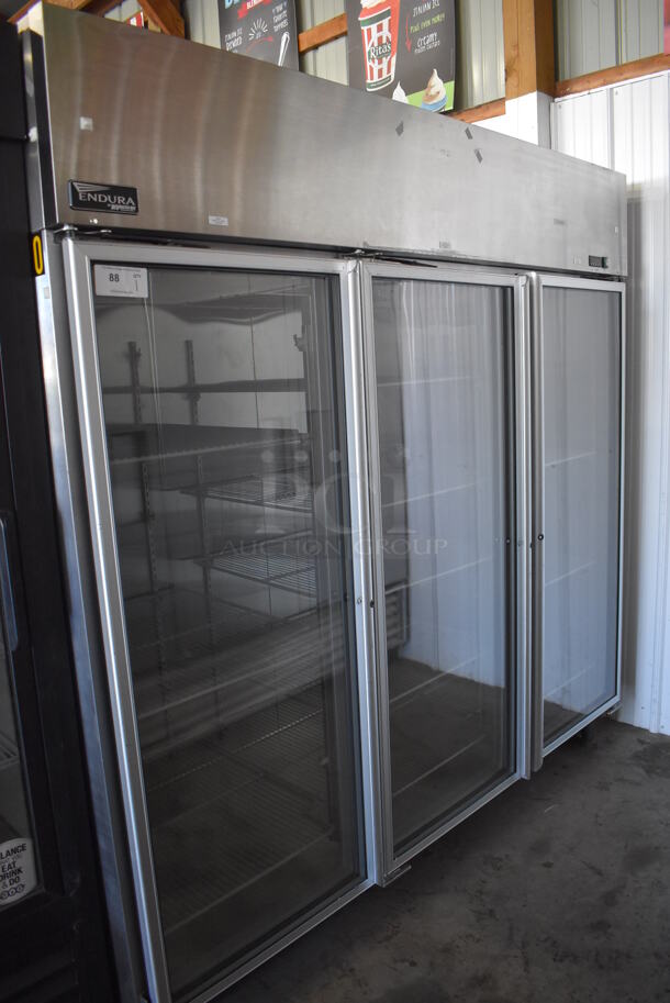 Master-Bilt Endura MNR803SSG/0X Stainless Steel Commercial 3 Door Reach In Cooler Merchandiser w/ Poly Coated Racks on Commercial Casters. 115 Volts, 1 Phase. 82.5x34x82. Tested and Working! - Image 1 of 7