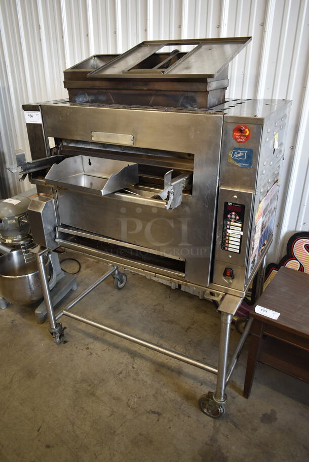 Duke Stainless Steel Commercial Natural Gas Powered Charbroiled Burger Grill on Commercial Casters. - Image 1 of 8