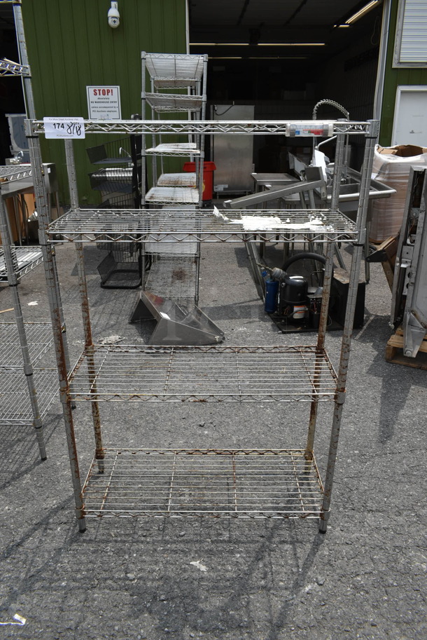 Chrome Finish 4 Tier Wire Shelving Unit. BUYER MUST DISMANTLE. PCI CANNOT DISMANTLE FOR SHIPPING. PLEASE CONSIDER FREIGHT CHARGES. - Image 1 of 5