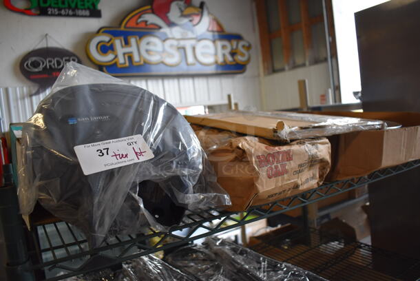 ALL ONE MONEY! Tier Lot of Various Items Including San Jamar Toilet Paper Dispenser, Royal Oak Charcoal Briquets and Aluminum Trays - Image 1 of 4