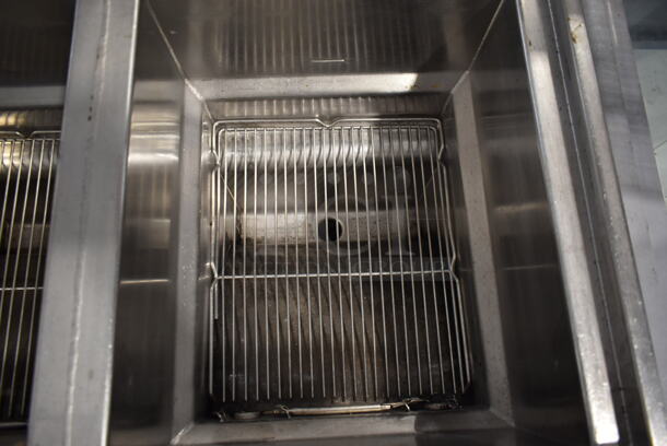 Henny Penny CG-303 Stainless Steel Commercial Floor Style  Natural Gas Powered 3 Bay Deep Fat Fryer w/ 3 Lids and 4 Metal Fry Baskets on Commercial Casters. 240,000 BTU. - Image 8 of 10