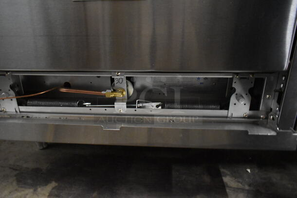 BRAND NEW SCRATCH AND DENT! Garland SunFire G60-6R24RR Stainless Steel Commercial Natural Gas Powered 6 Burner Range w/ Right Side Flat Top Griddle and 2 Ovens. - Image 9 of 11