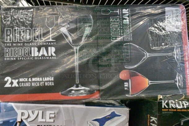 8 Various Items Including Nutrichef NGLWINE99 Wine Glass, Nutrichef NGWINE88 Crystal Clear Stemless Wine Set, Pyle PLMRA620 Elite Series Waterproof Amplifier, Krups GQ502D51 Panini Press, Riedel Bar Crystal Glasses, Umboo Bamboo Stove Topper Cutting Board, Krups Waffle Maker. 8 Times Your Bid! - Image 8 of 12