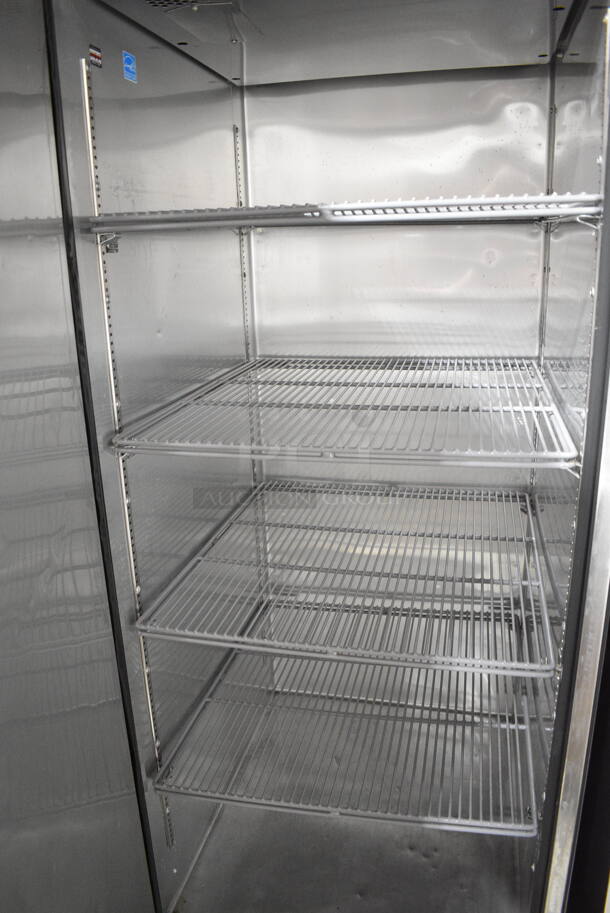 LATE MODEL! True ENERGY STAR Stainless Steel Commercial Single Door Reach In Cooler on Commercial Casters. See Pictures for Dent on Side. 115 Volts, 1 Phase. Tested and Working! - Image 3 of 4
