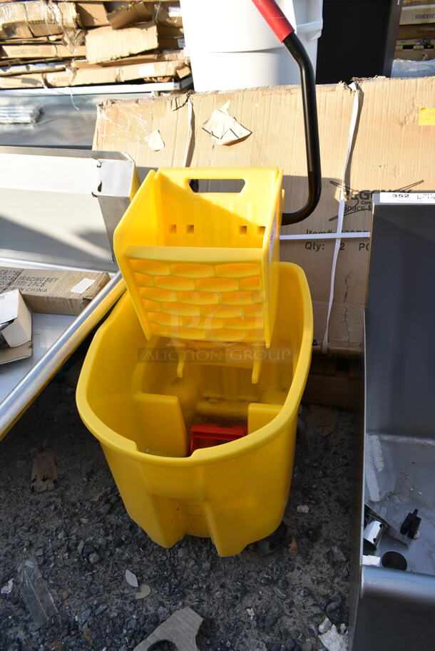 BRAND NEW SCRATCH AND DENT! Yellow Poly Mop Bucket w/ Wringing Attachment on Commercial Casters.  - Image 3 of 4