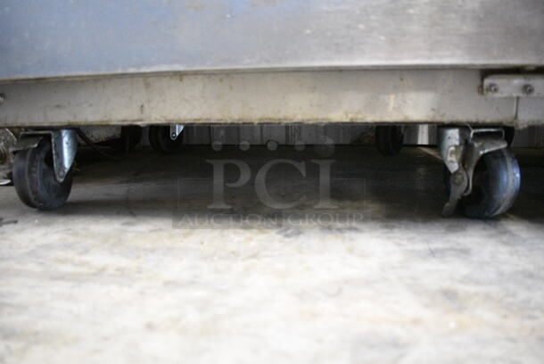Everest ESF1 Stainless Steel Commercial Single Door Reach In Freezer w/ Poly Coated Racks on Commercial Casters. 115 Volts, 1 Phase. Tested and Powers On But Does Not Get Cold - Image 2 of 4