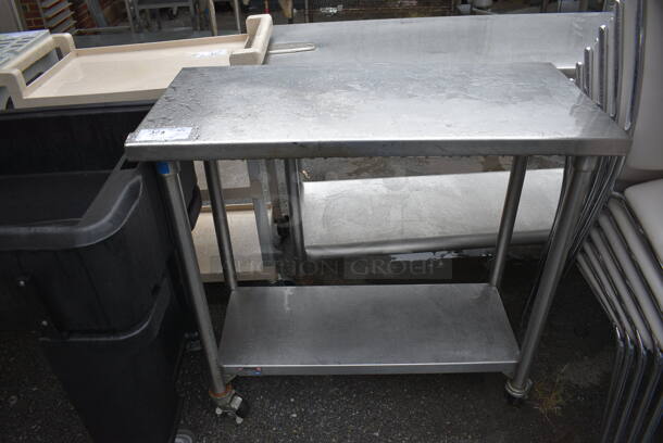 Stainless Steel Table w/ Under Shelf on Commercial Casters. 38x18x36