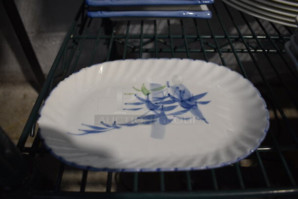 2 White and Blue Ceramic Plates. 8x5x1. 2 Times Your Bid!