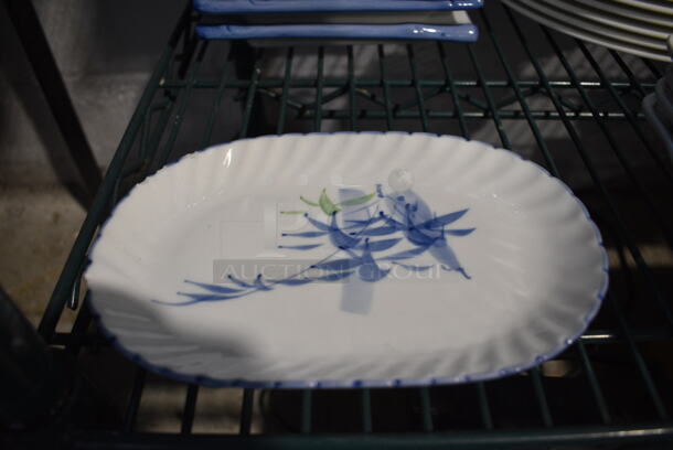 2 White and Blue Ceramic Plates. 8x5x1. 2 Times Your Bid! - Image 1 of 3