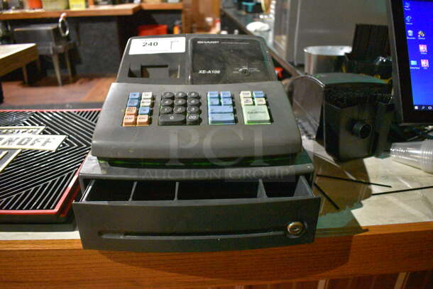 Sharp XE-A106 Countertop Electronic Cash Register. 13x14x10. (bar)