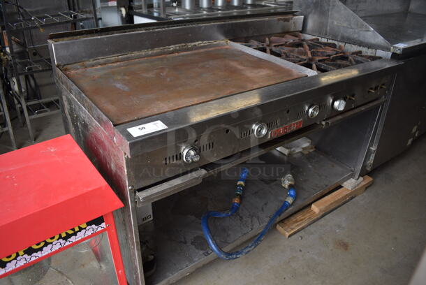 Blodgett Stainless Steel Commercial Natural Gas Powered Flat Top Griddle w/ 4 Burner Range, Gas Hose and Under Shelf on Commercial Casters. One Caster Needs To Be Reattached. 60x31x43
