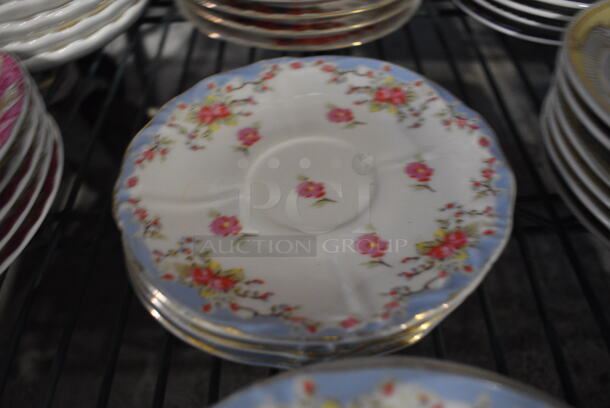 4 White Ceramic Saucers w/ Blue Rim and Floral Pattern. 6x6x1. 4 Times Your Bid! - Image 1 of 3