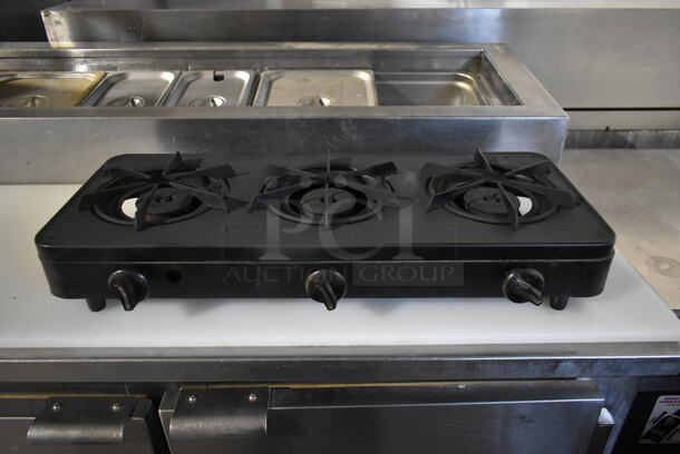Superb Metal Countertop Propane Gas Powered 3 Burner Range.  - Image 1 of 5