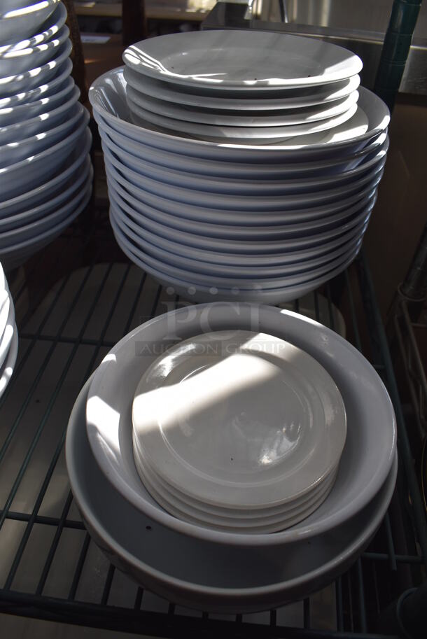 ALL ONE MONEY! Lot of Green Finish 4 Tier Shelving Unit on Commercial Casters w/ Contents Including 3 Bagel Cutters, Poly Bowls, Poly Trays, Ceramic Vases, Ceramic Plates. BUYER MUST DISMANTLE. PCI CANNOT DISMANTLE FOR SHIPPING. PLEASE CONSIDER FREIGHT CHARGES. 48x18x80.  - Image 6 of 12