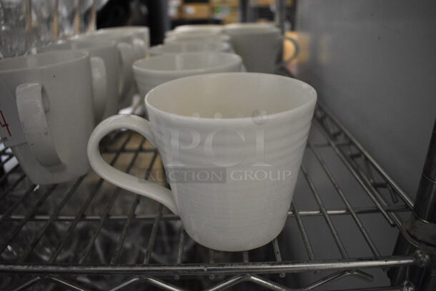 8 White Ceramic Mugs. 5x4.5x3. 8 Times Your Bid!