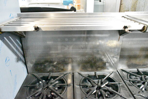 Garland M44R Stainless Steel Commercial Floor Style Natural Gas Powered 4 Burner Range w/ Oven, Over Shelf and Back Splash on Commercial Casters.  - Image 3 of 7
