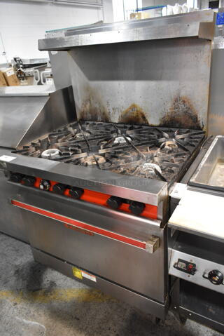 Vulcan 36L-572 Stainless Steel Commercial Propane Gas Powered 6 Burner Range w/ Oven, Over Shelf and Back Splash on Commercial Casters. 