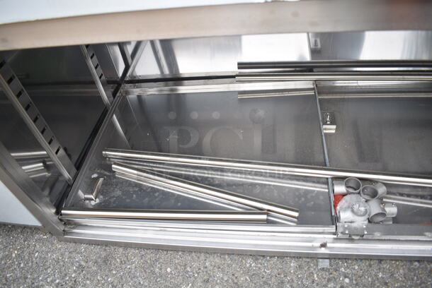 BRAND NEW SCRATCH AND DENT! Regency 600EBTB3096D 30" x 96" 16 Gauge Type 304 Stainless Steel Enclosed Base Sliding Door Table with Adjustable Midshelf and 6" Backsplash - Image 7 of 8