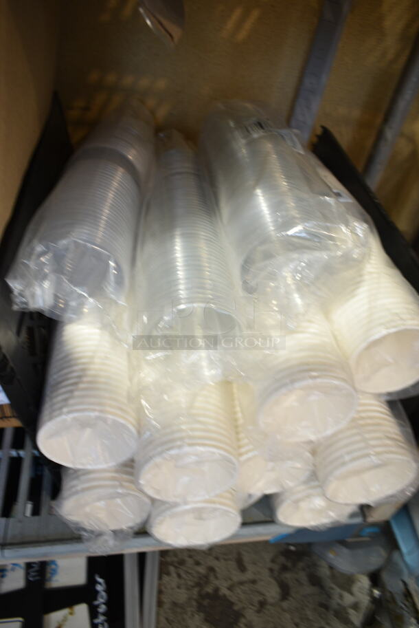 ALL ONE MONEY! Tier Lot of Various Items Including Plastic Wrap, Choice Poly Gloves, Bakery Tissue, 612P527 Choice 7" Clear Round Plastic Dome Lid - 500/Case, Sani-Sure Soft Serve Sanitizer and Cleaner, 999CC16 Cups.  - Image 9 of 12