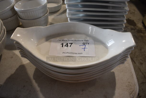 7 White Ceramic Single Serving Casserole Dishes. 10x5.5x2. 7 Times Your Bid!