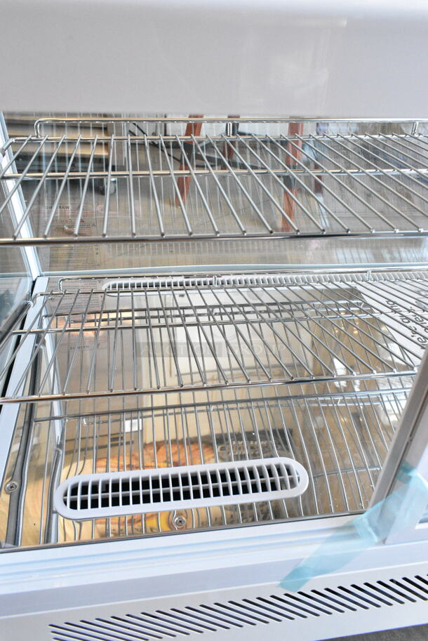BRAND NEW SCRATCH AND DENT! Avantco 360BCC35HCW 34 1/5" White Refrigerated Countertop Bakery Display Case with LED Lighting. See Pictures for Broken Glass. 115 Volts, 1 Phase. Tested and Working! - Image 9 of 10