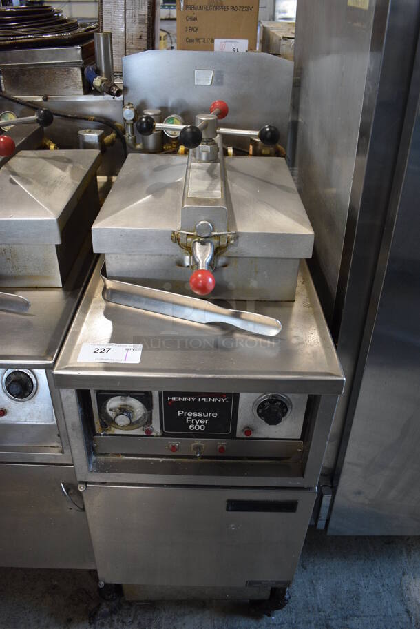 Henny Penny Model PFG-600 Stainless Steel Commercial Floor Style Natural Gas Powered Pressure Fryer w/ Fry Basket on Commercial Casters. 18x39x49