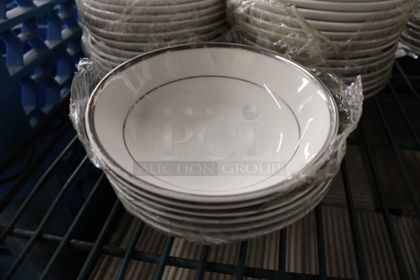 7 White Ceramic Bowls w/ Silver Colored Lines on Rim. 5x5x1. 7 Times Your Bid!