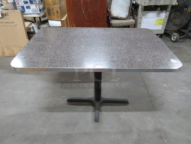 One Grey Laminate Table Top With Chrome Trim, On A Pedestal Base. 48X30X30