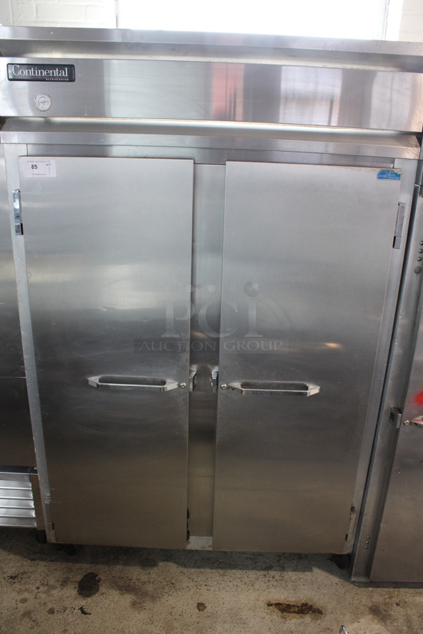 Continental Model 2R Stainless Steel Commercial 2 Door Reach In Cooler w/ Poly Coated Racks on Commercial Casters. 115 Volts, 1 Phase. 52.5x37x82. Tested and Working!