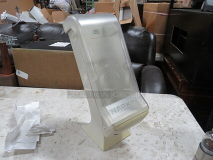 One Tork Xpress Napkin Dispenser.