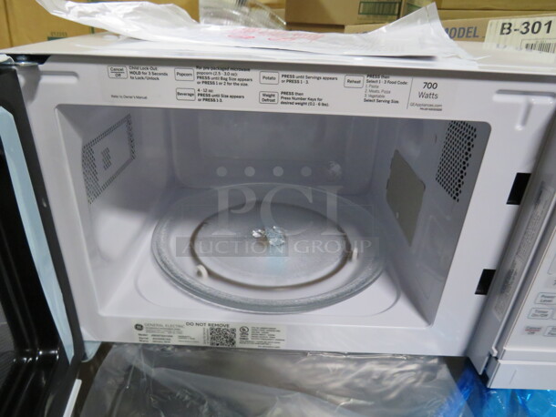 One NEW GE Microwave. 700 Watt. Model# JEM3072DHWW. 18X13X10. $191.43 - Image 3 of 4