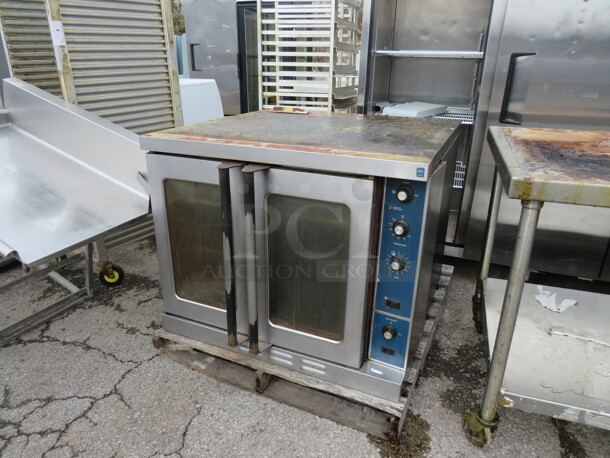One Natural Gas Full Size Convection Oven With 3 Racks. 38X38X31. WORKING WHEN REMOVED.