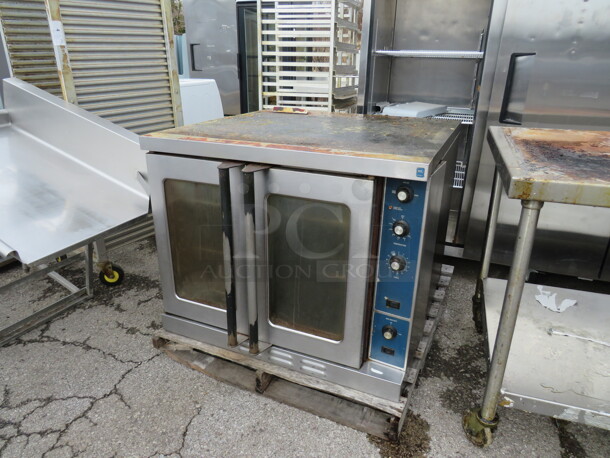One Natural Gas Full Size Convection Oven With 3 Racks. 38X38X31. WORKING WHEN REMOVED. - Image 1 of 2