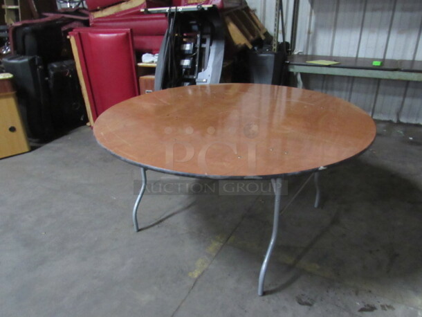One 60 Inch Round Wood Folding Banquet Table With Clear Coated Finish Top. GREAT SHAPE!!!