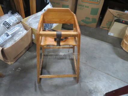 One Wooden High Chair.