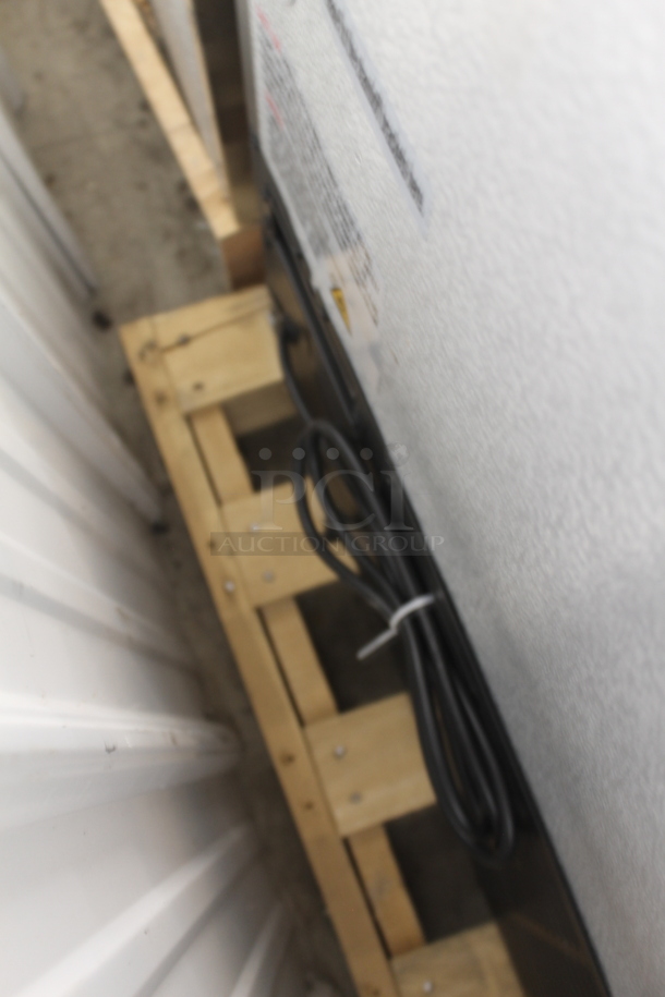 BRAND NEW SCRATCH AND DENT!  Avantco 178SSWT60FHC Commercial Stainless Steel Two Door Worktop Freezer With Backsplash, Polycoated Racks And Commercial Casters. 115V. Tested and Working! - Image 8 of 8