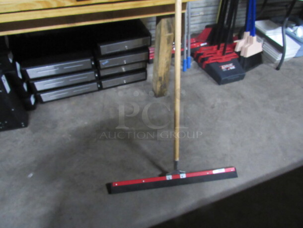 One 30 Inch Floor Squeegee With Wooden Handle.