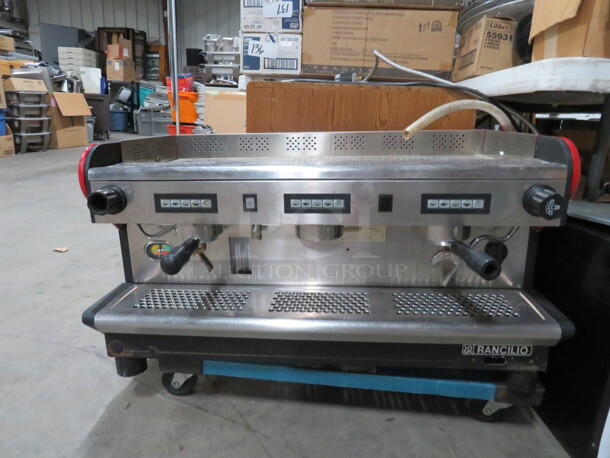 One Rancilio 3 Group Espresso Machine.