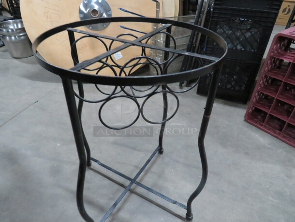 One Black Metal Round Table Base That Will Hold 5 Wine Bottles Under.  17X23